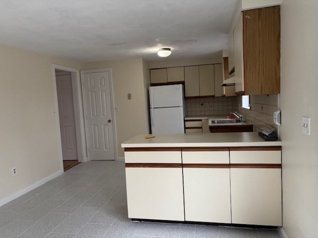 317 Cross Street, Unit 317 Winchester, MA 01890 - Photo 5 of 16 a kitchen with cabinets and appliances