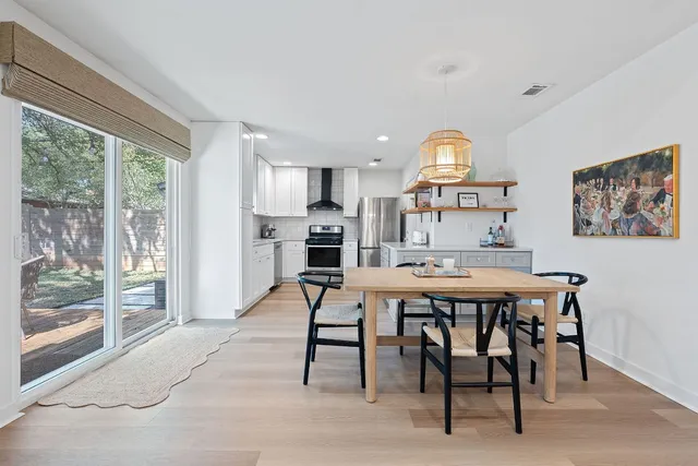 a kitchen with a table and chairs