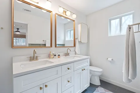 a bathroom with a sink and mirror