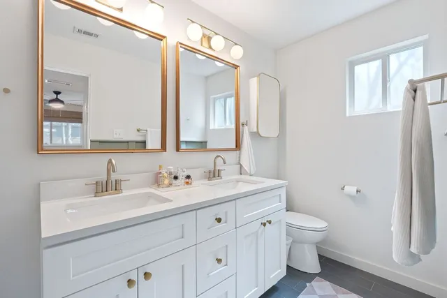 a bathroom with a sink and mirror