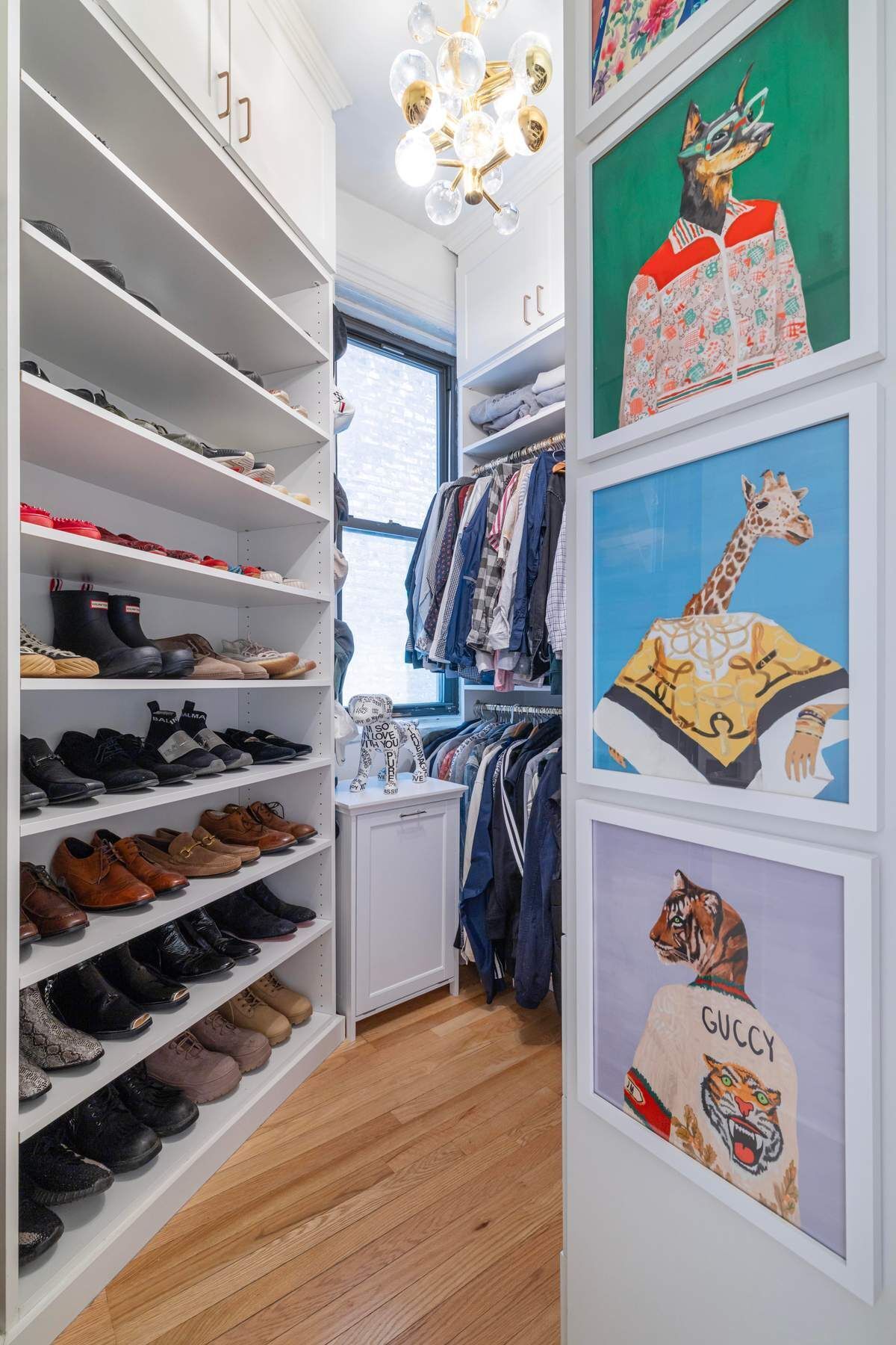 350 West 48th Street, Unit 4E Manhattan, NY 10036 - Photo 10 of 12 a view of walk in closet with clothes and shoes