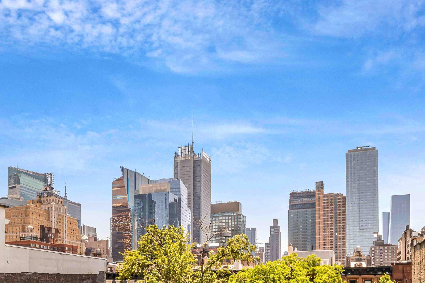 350 West 48th Street, Unit 4E Manhattan, NY 10036 - Photo 11 of 12 a view of a city with tall buildings