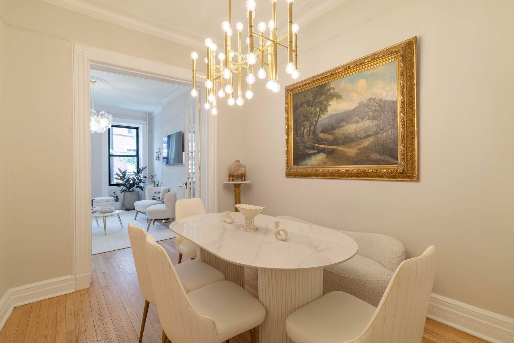 350 West 48th Street, Unit 4E Manhattan, NY 10036 - Photo 3 of 12 a view of a dining room with furniture and chandelier