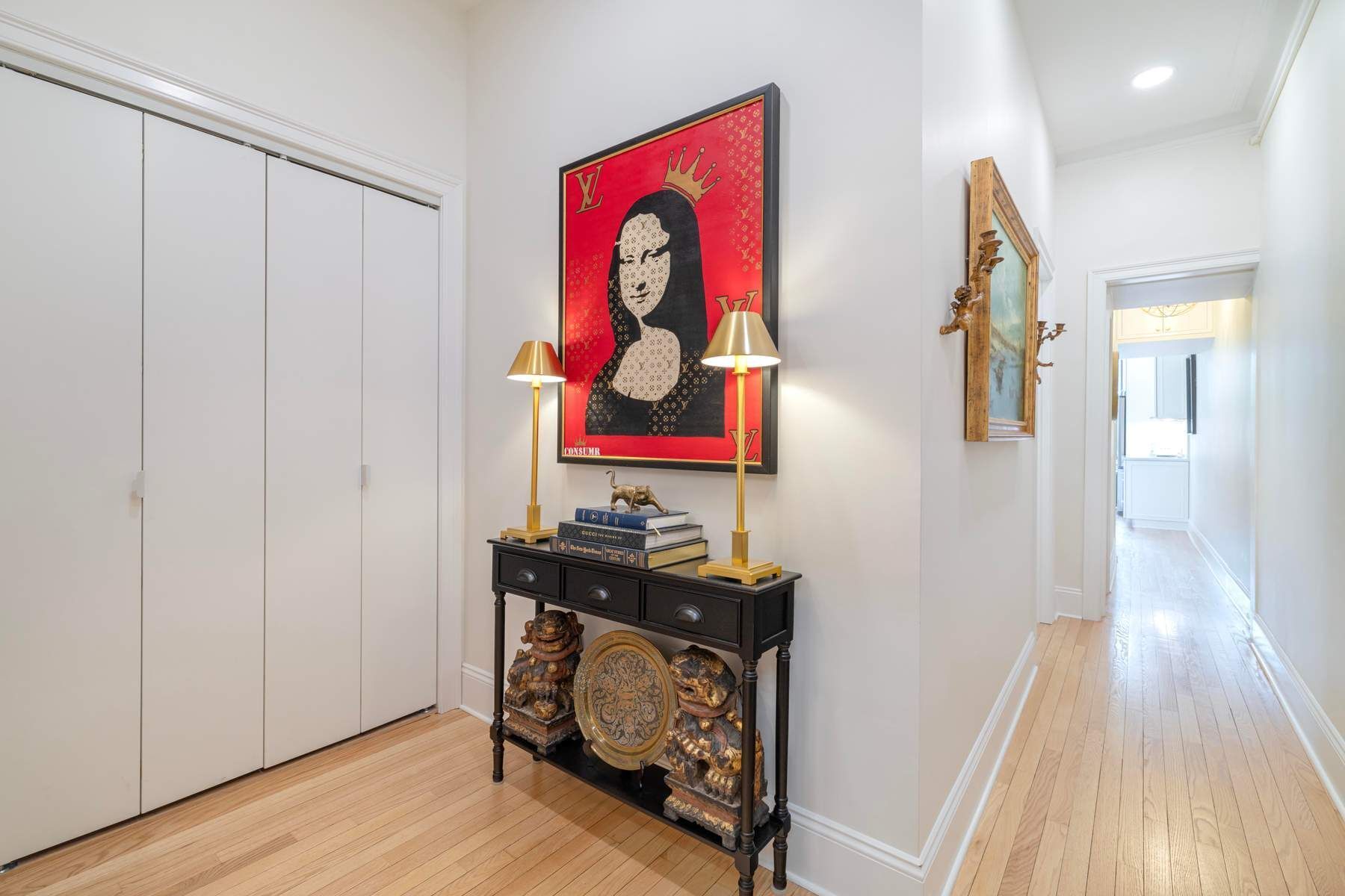 350 West 48th Street, Unit 4E Manhattan, NY 10036 - Photo 7 of 12 a view of a hallway with wooden floor and a workspace