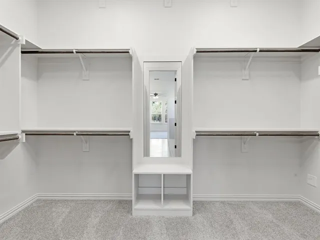 a view of an empty walk in closet