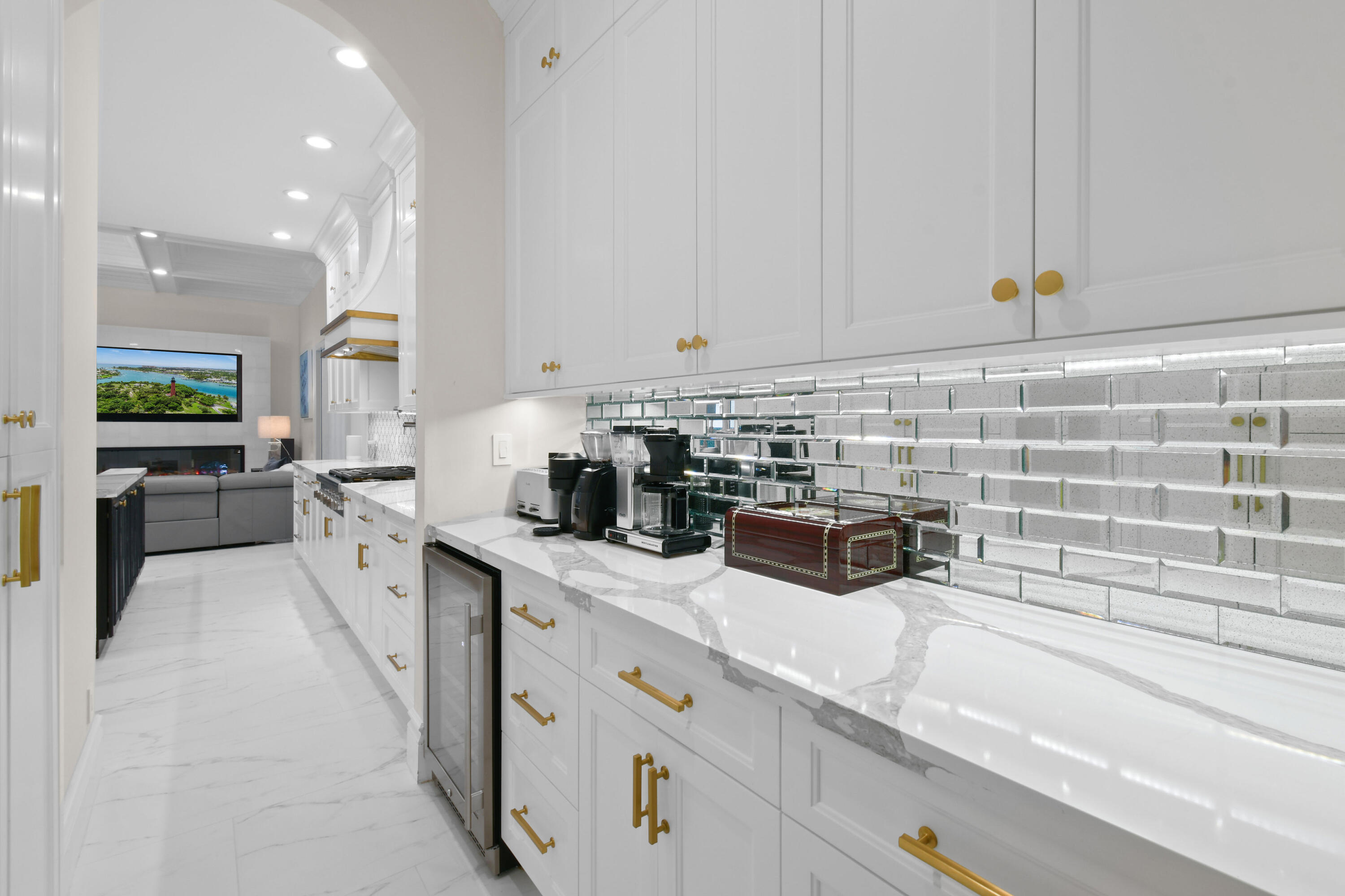 123 Barcelona Drive Jupiter, FL 33458 - Photo 11 of 59 a kitchen with lots of counter top space and white cabinets