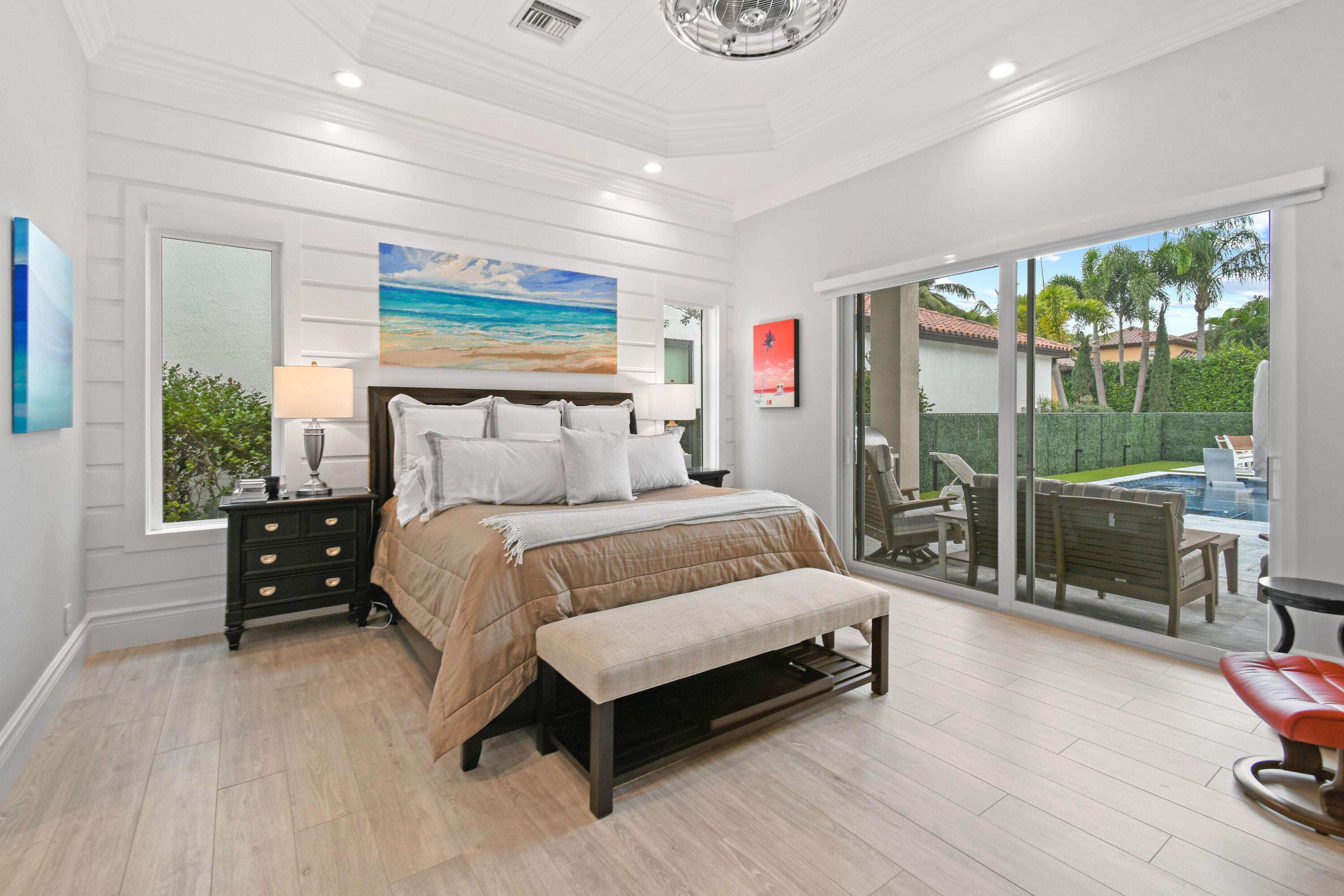 123 Barcelona Drive Jupiter, FL 33458 - Photo 17 of 59 a bedroom with a bed and large window