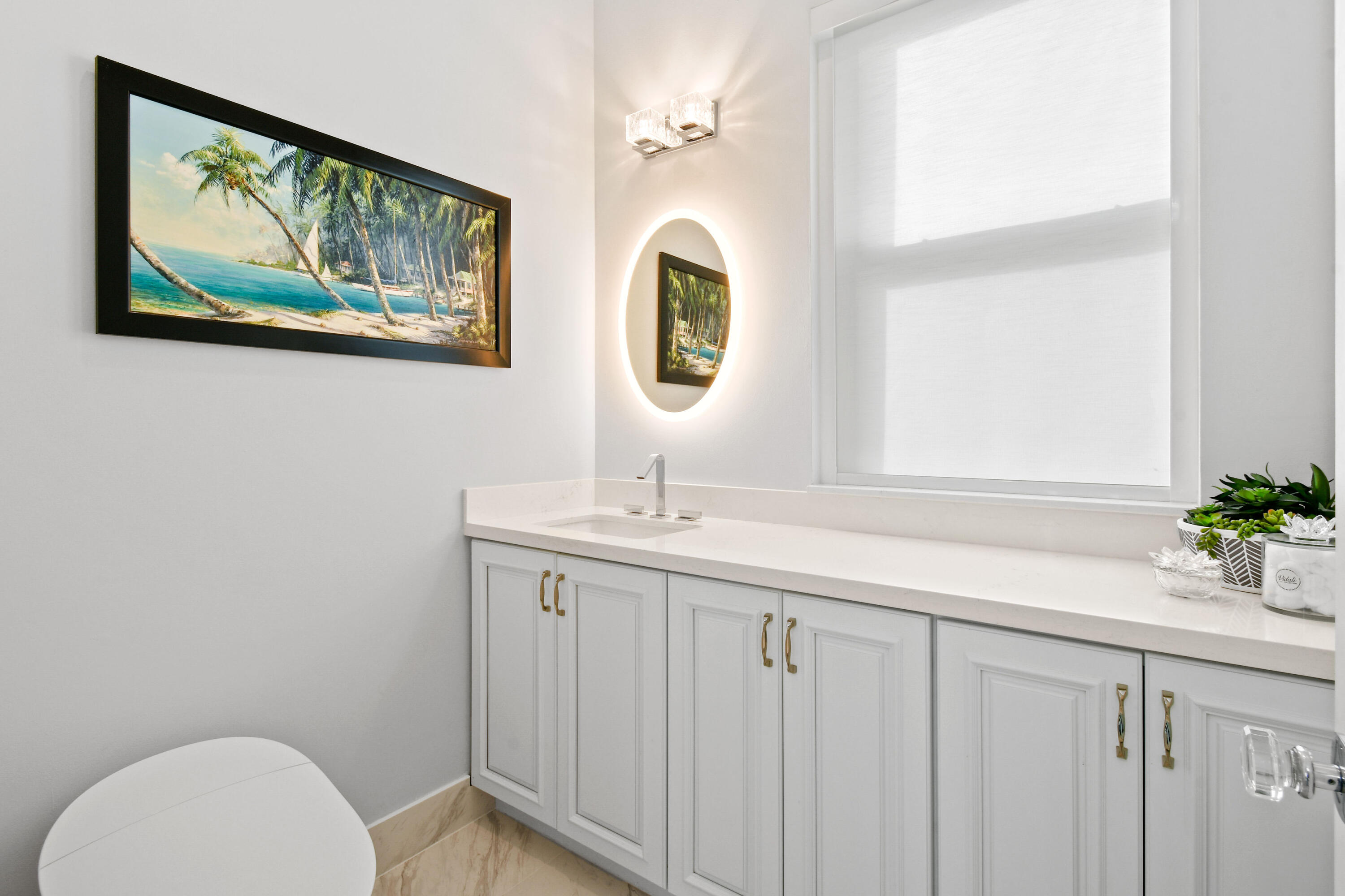 123 Barcelona Drive Jupiter, FL 33458 - Photo 22 of 59 a bathroom with a sink and a mirror