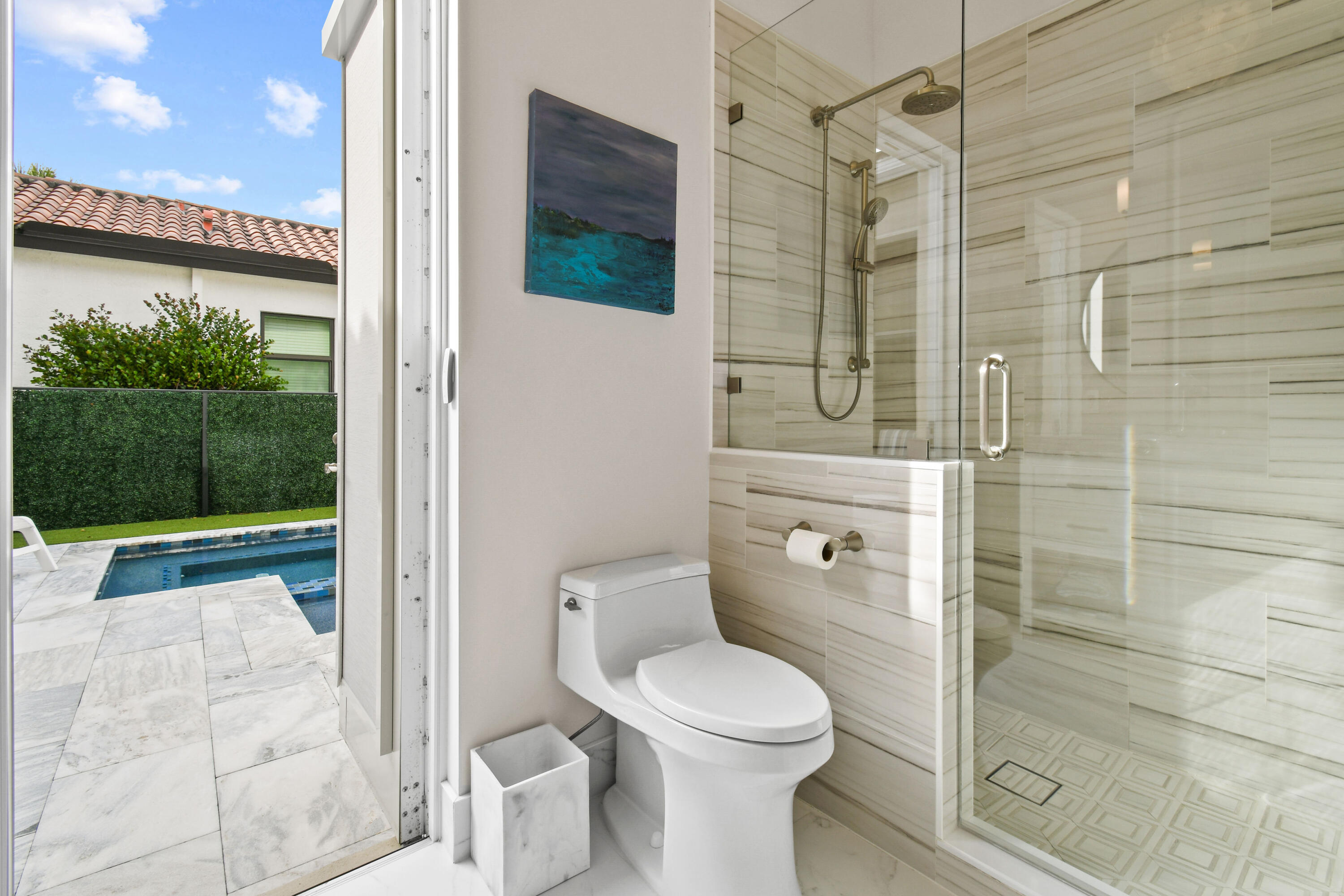 123 Barcelona Drive Jupiter, FL 33458 - Photo 26 of 59 a white toilet sitting next to a bathroom sink