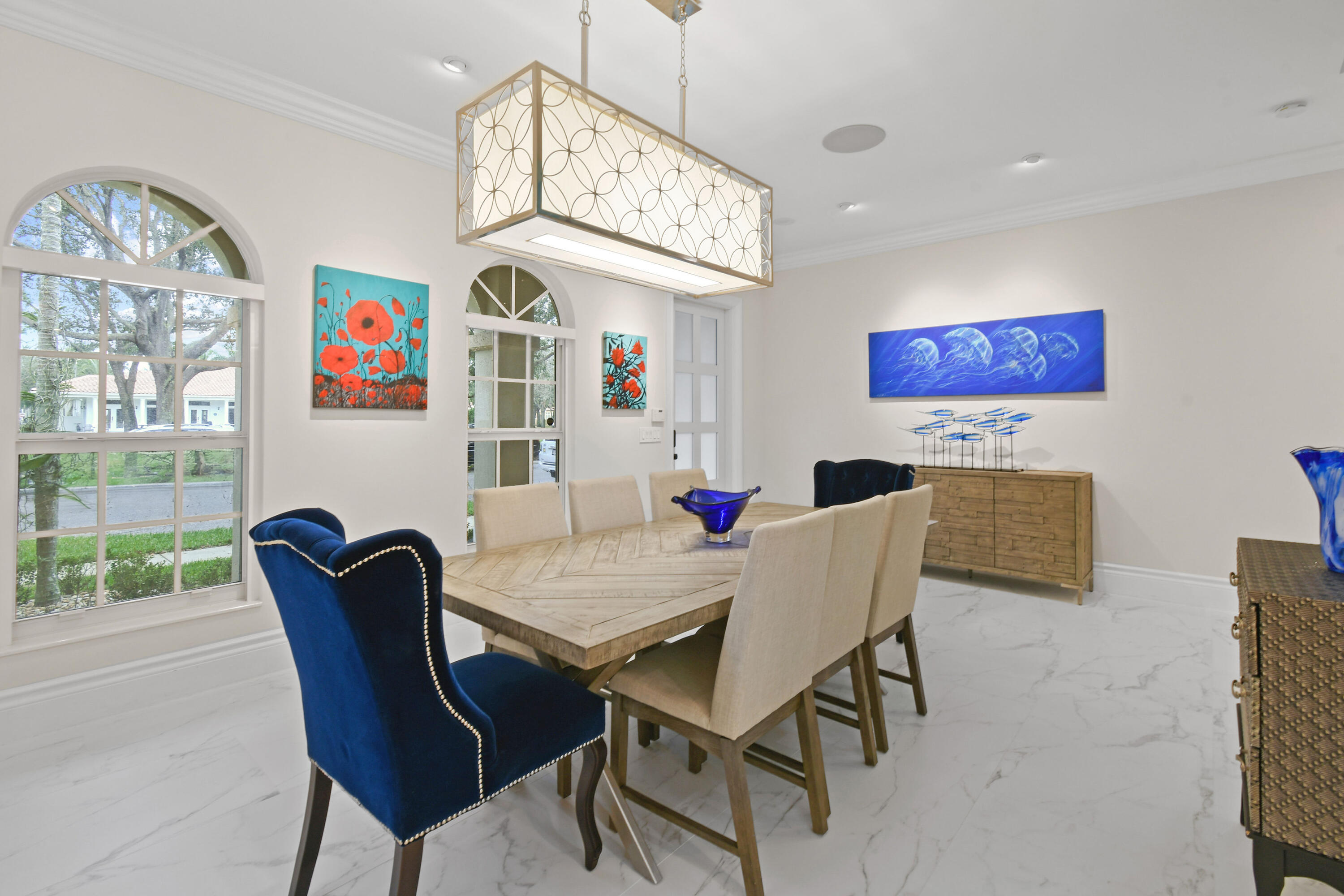 123 Barcelona Drive Jupiter, FL 33458 - Photo 3 of 59 a view of a dining room with furniture a chandelier and a window