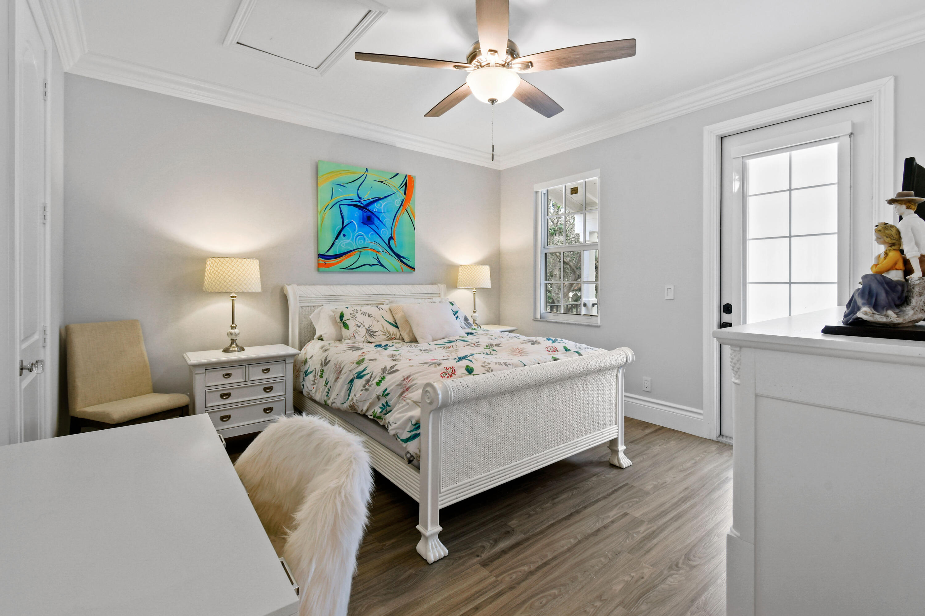 123 Barcelona Drive Jupiter, FL 33458 - Photo 32 of 59 a bedroom with a bed and a large window