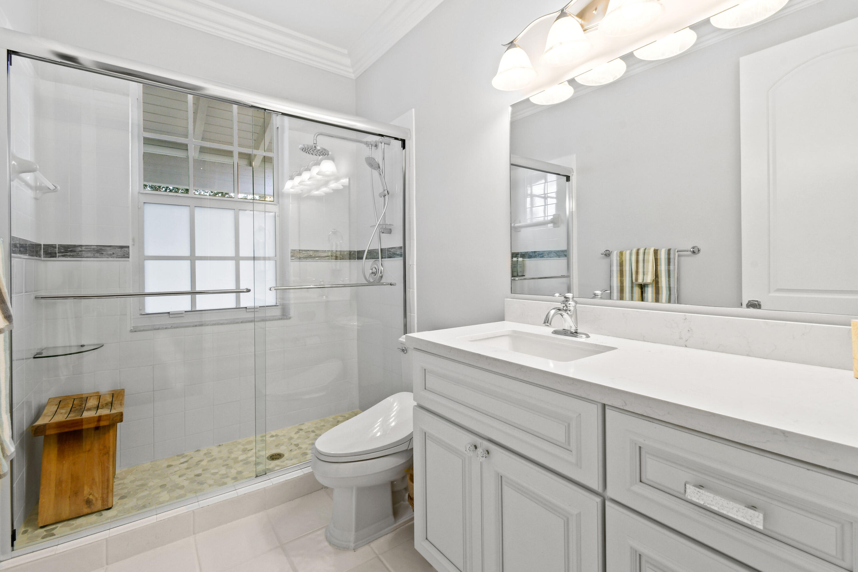 123 Barcelona Drive Jupiter, FL 33458 - Photo 34 of 59 a bathroom with a sink a toilet and shower