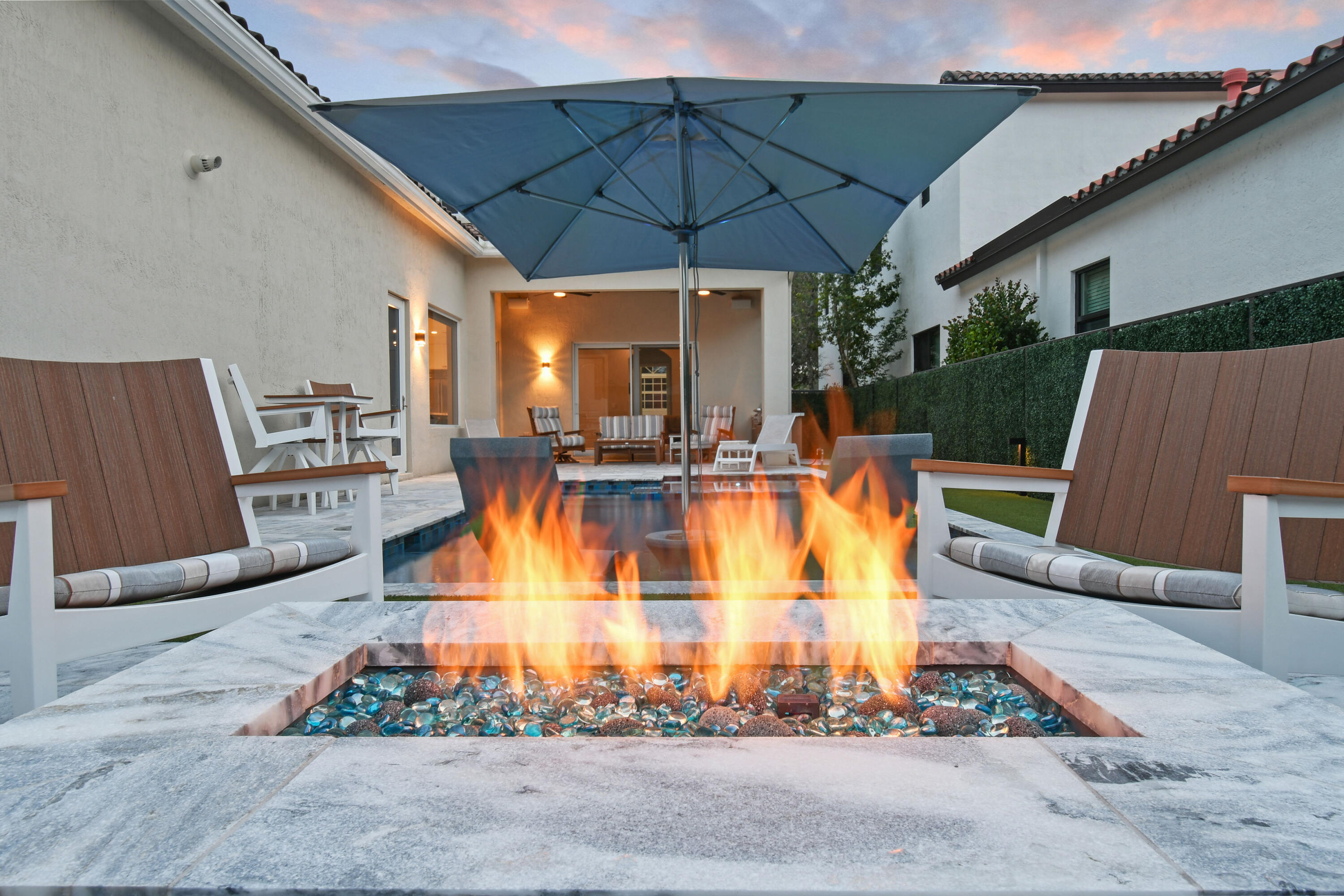 123 Barcelona Drive Jupiter, FL 33458 - Photo 50 of 59 a view of a swimming pool with a patio