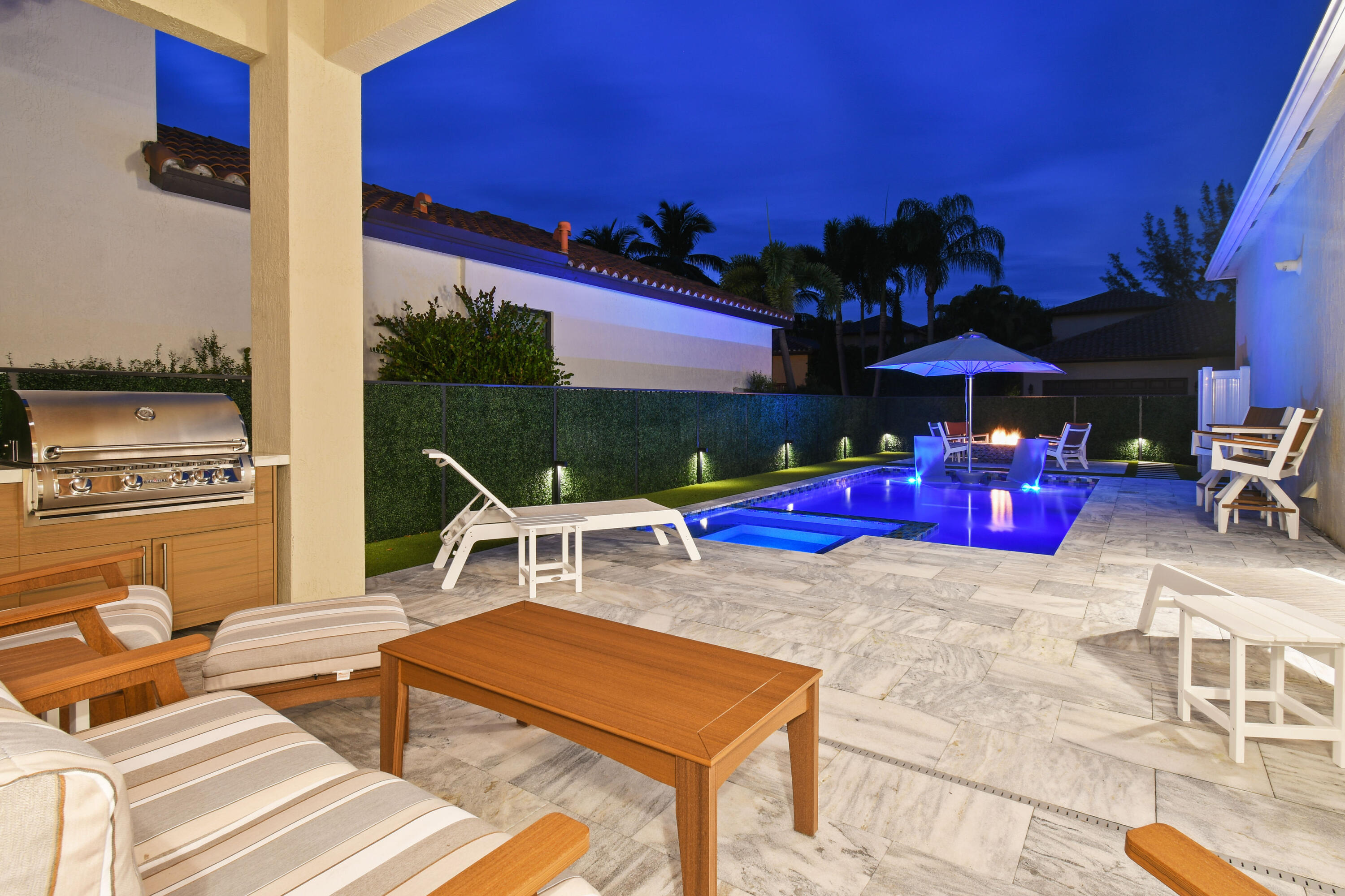 123 Barcelona Drive Jupiter, FL 33458 - Photo 59 of 59 a building outdoor space with patio furniture