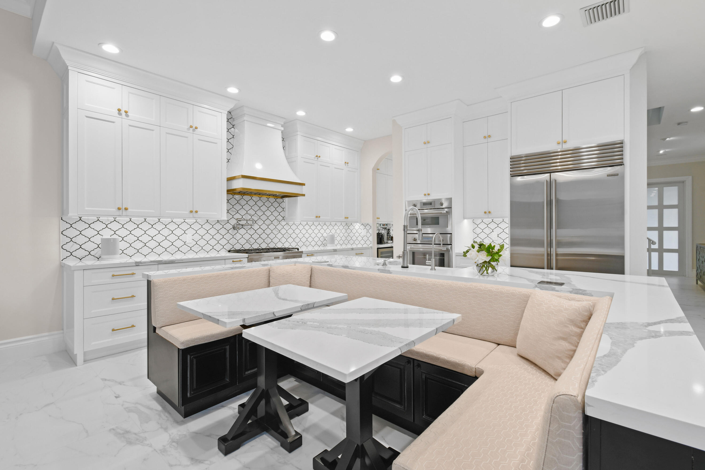 123 Barcelona Drive Jupiter, FL 33458 - Photo 8 of 59 a kitchen with a table chairs refrigerator and stove