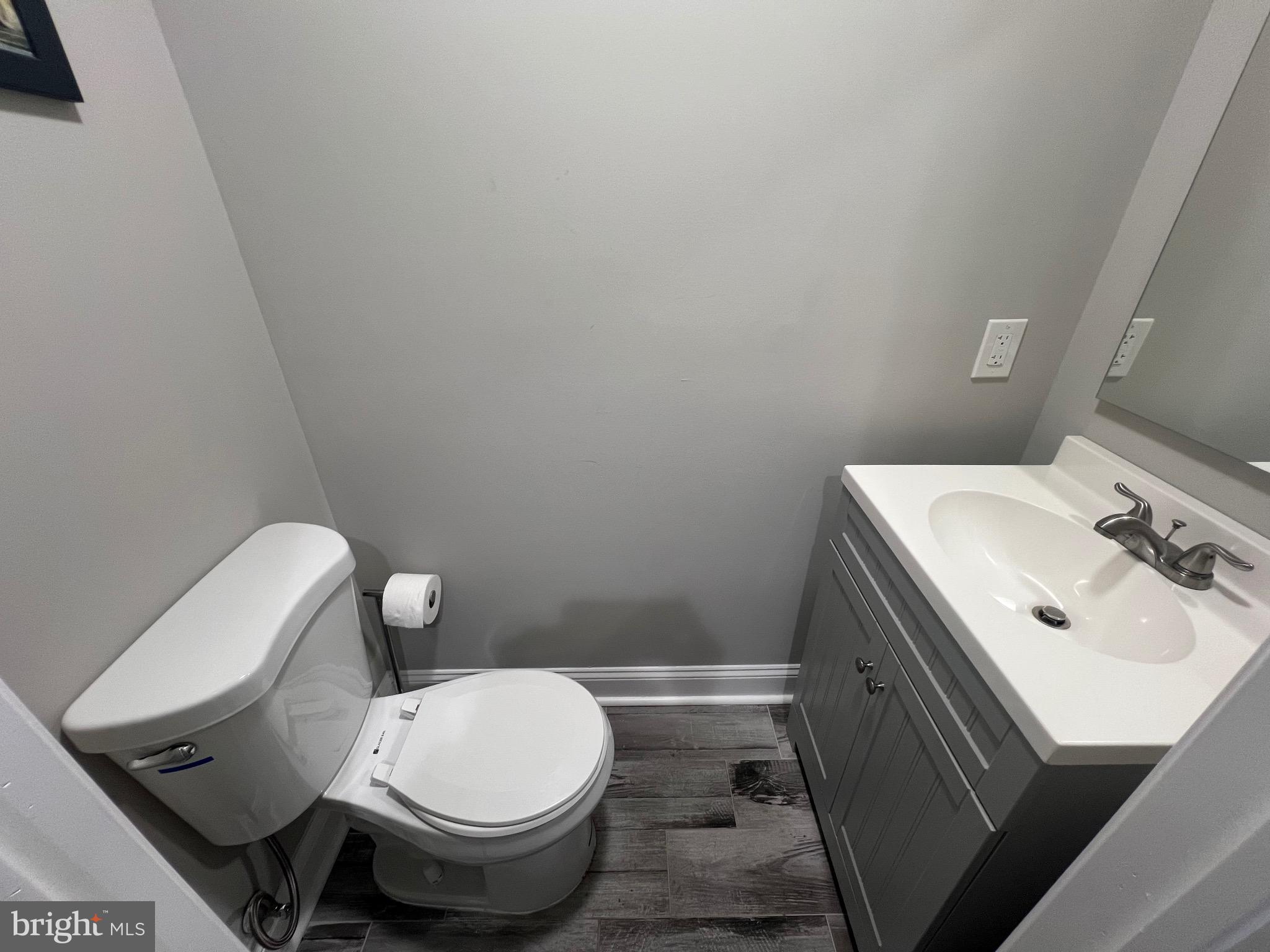 1206 Sycamore Avenue Croydon, PA 19021 - Photo 11 of 24 a white toilet sitting next to a bathroom sink