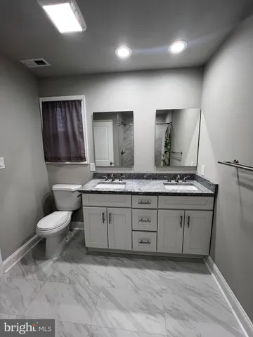 a bathroom with a sink and a toilet