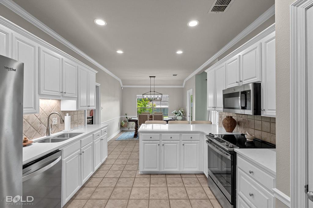 116 Augusta Avenue Benton, LA 71006 - Photo 18 of 38 a kitchen with a sink stainless steel appliances and cabinets
