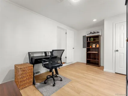 a view of a workspace with furniture