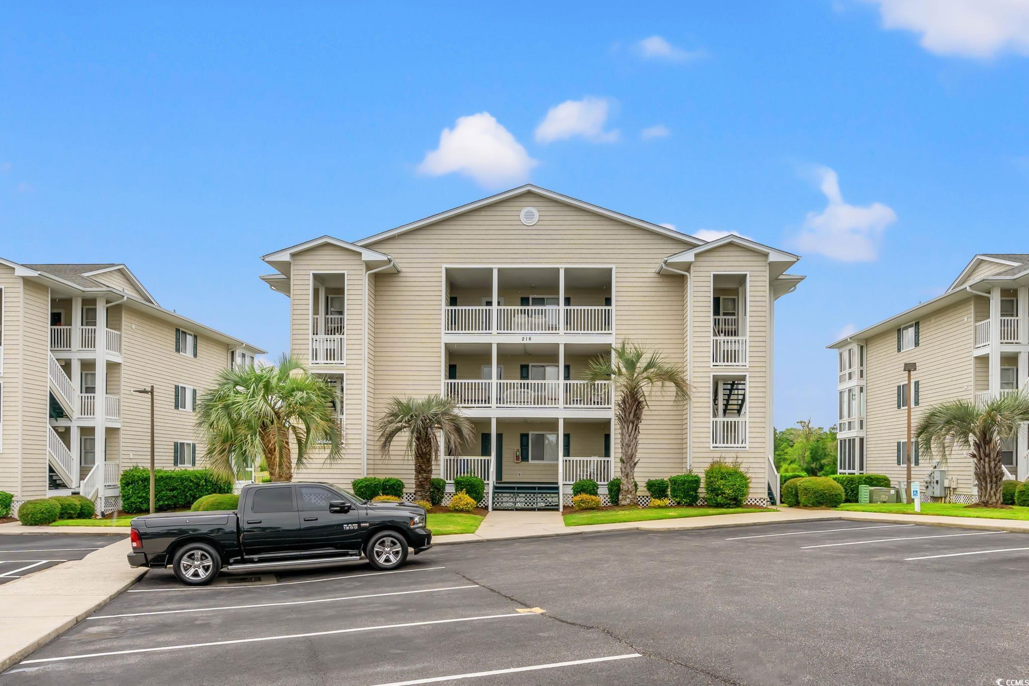 216 Landing Road, Unit H216 North Myrtle Beach, SC 29582 - Photo 1 of 23 View of property with uncovered parking