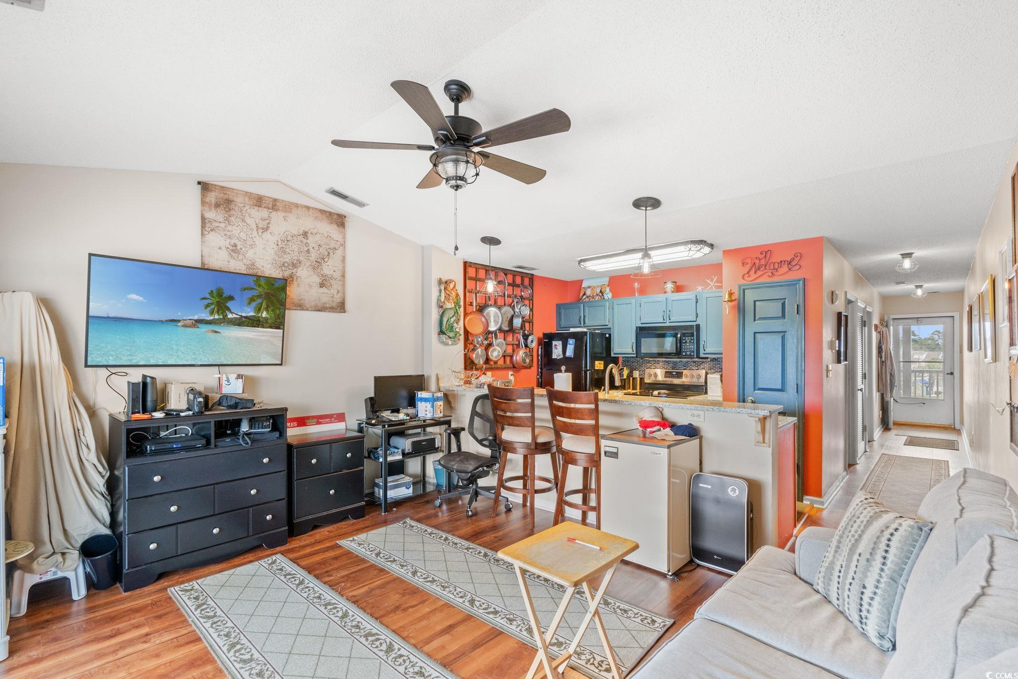 216 Landing Road, Unit H216 North Myrtle Beach, SC 29582 - Photo 23 of 23 Kitchen with a peninsula, white dishwasher, pendant lighting, open floor plan, and a ceiling fan