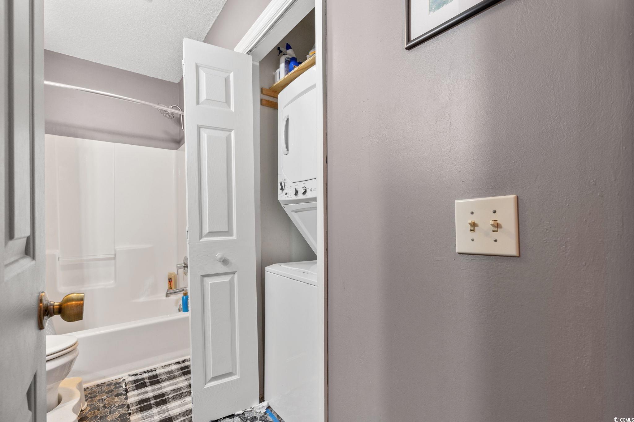 216 Landing Road, Unit H216 North Myrtle Beach, SC 29582 - Photo 17 of 23 Bedroom with wood finished floors, a textured ceiling, and a ceiling fan