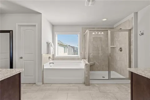 a living room with furniture and a ceiling fan