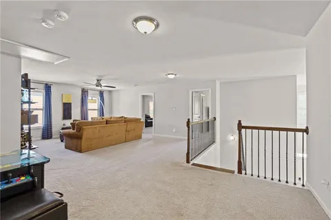a spacious bathroom with a granite countertop sink mirror and a bathtub