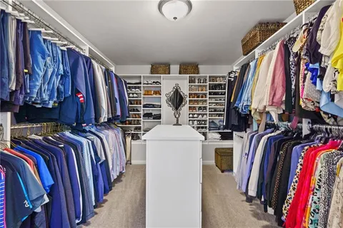a living room with furniture a rug and a window