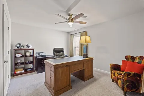 a spacious bedroom with a bed and a flat screen tv