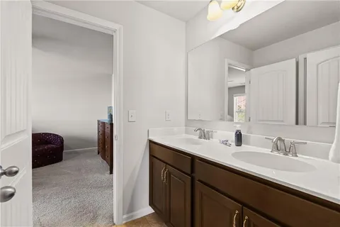a living room with furniture and a ceiling fan