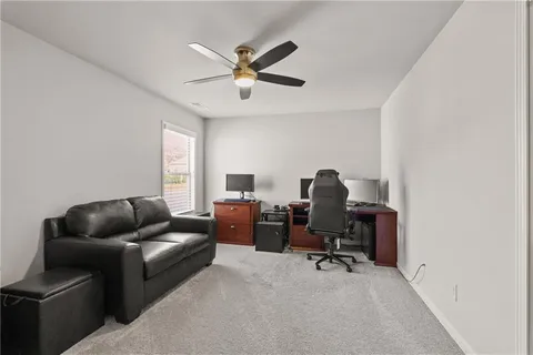 a view of a hallway with wooden walls