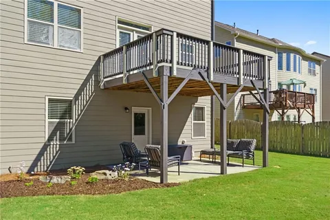 a view of a chair and table in the garden