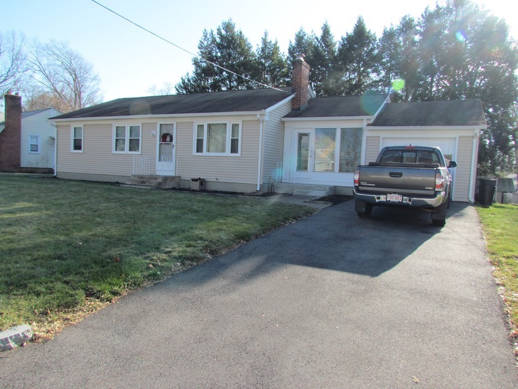 33 Kittrell Street Springfield, MA 01119 - Photo 1 of 23 a view of a house with a cars park in front of a house