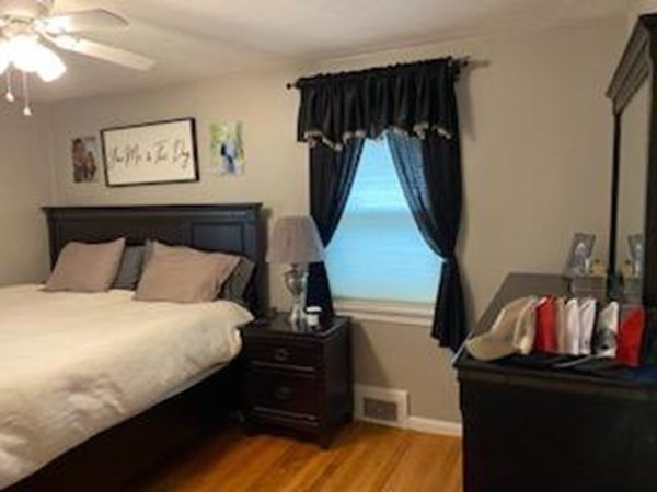 33 Kittrell Street Springfield, MA 01119 - Photo 16 of 23 a bedroom with bed and wooden floor