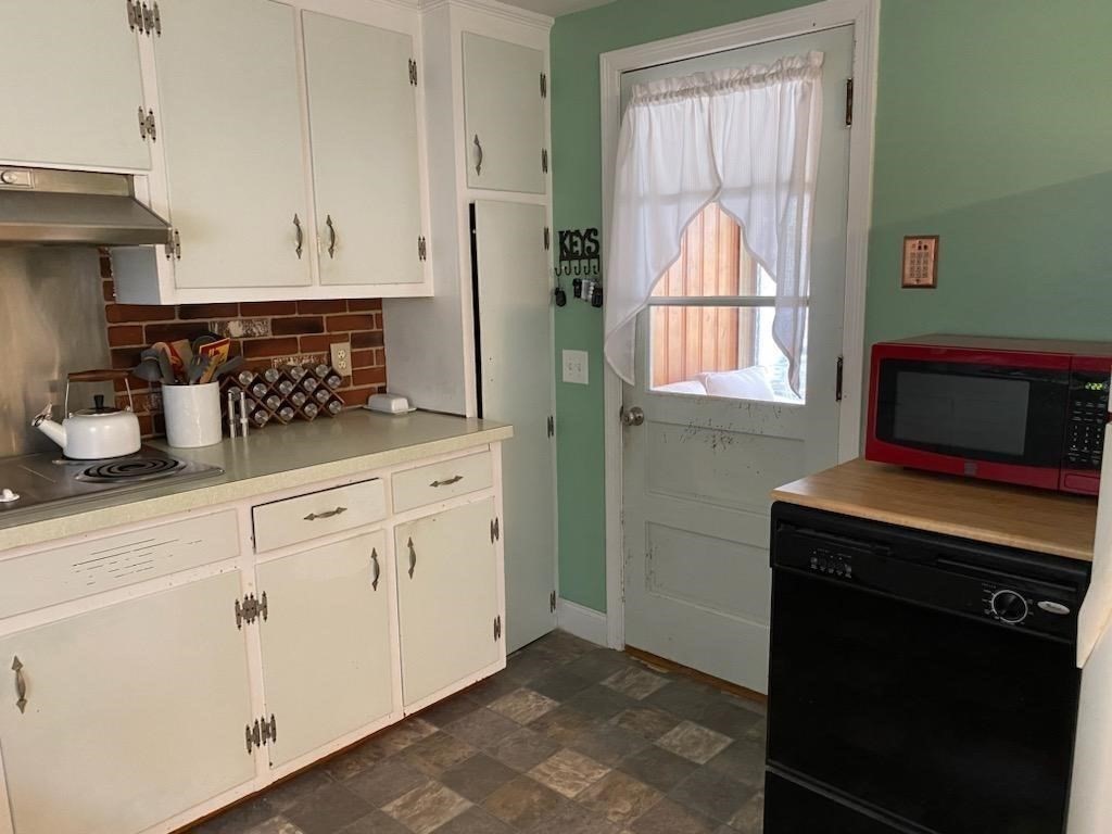 33 Kittrell Street Springfield, MA 01119 - Photo 7 of 23 a kitchen with white cabinets and a stove