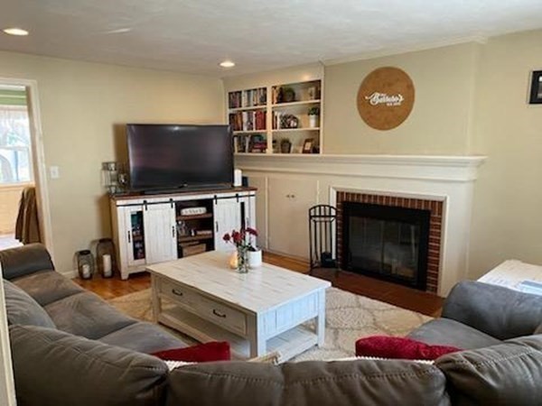 33 Kittrell Street Springfield, MA 01119 - Photo 8 of 23 a living room with furniture a flat screen tv and a fireplace
