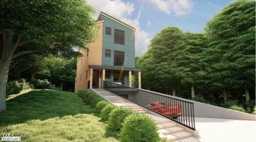 a view of a house with backyard and sitting area