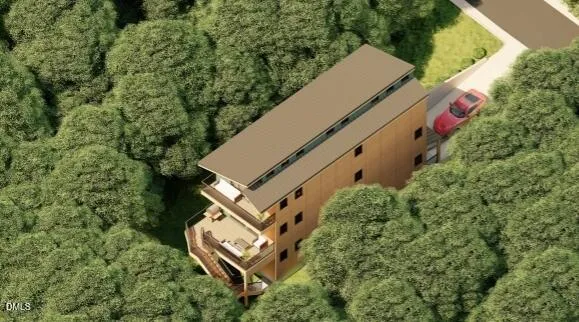 an aerial view of a house with a yard and trees