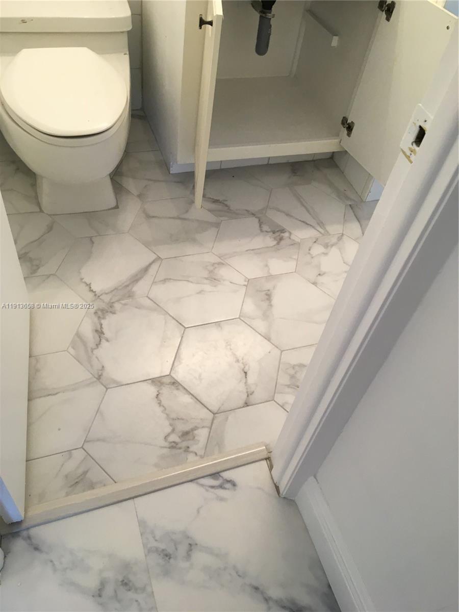 5838 Collins Avenue, Unit PHF Miami Beach, FL 33140 - Photo 11 of 16 a bathroom with a toilet and a shower