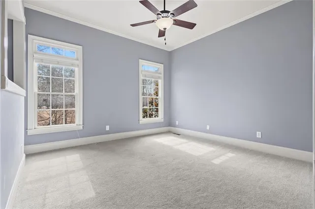 an aerial view of a house with a garden and lake view