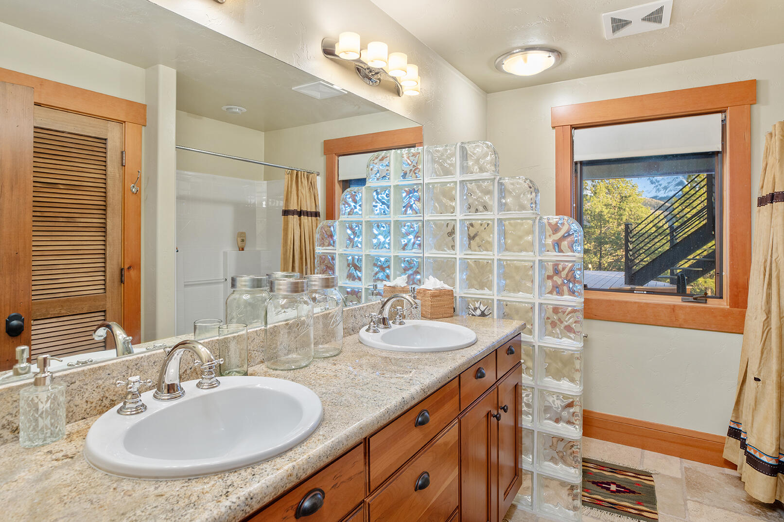 727 West Anderson Road Placerville, CO 81430 - Photo 15 of 31 a bathroom with a granite countertop sink and a mirror
