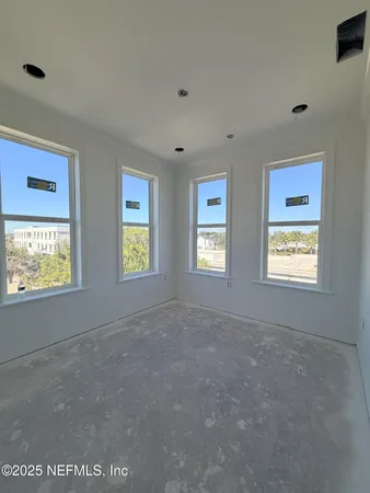 an empty room with windows