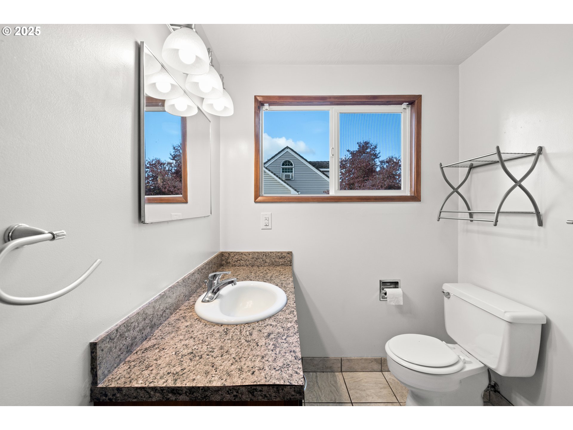 3396 Southeast Loeffelman Road Milwaukie, OR 97222 - Photo 23 of 41 a bathroom with a toilet a sink and a mirror