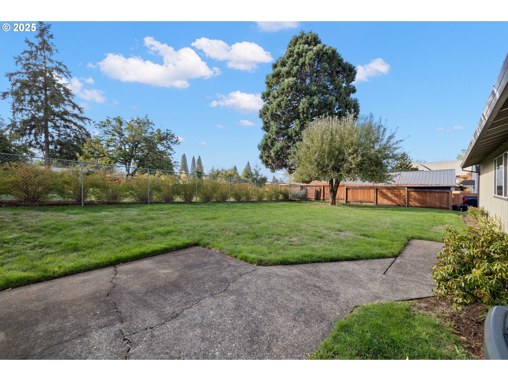 3396 Southeast Loeffelman Road Milwaukie, OR 97222 - Photo 30 of 41 a view of a big house with a big yard and potted plants