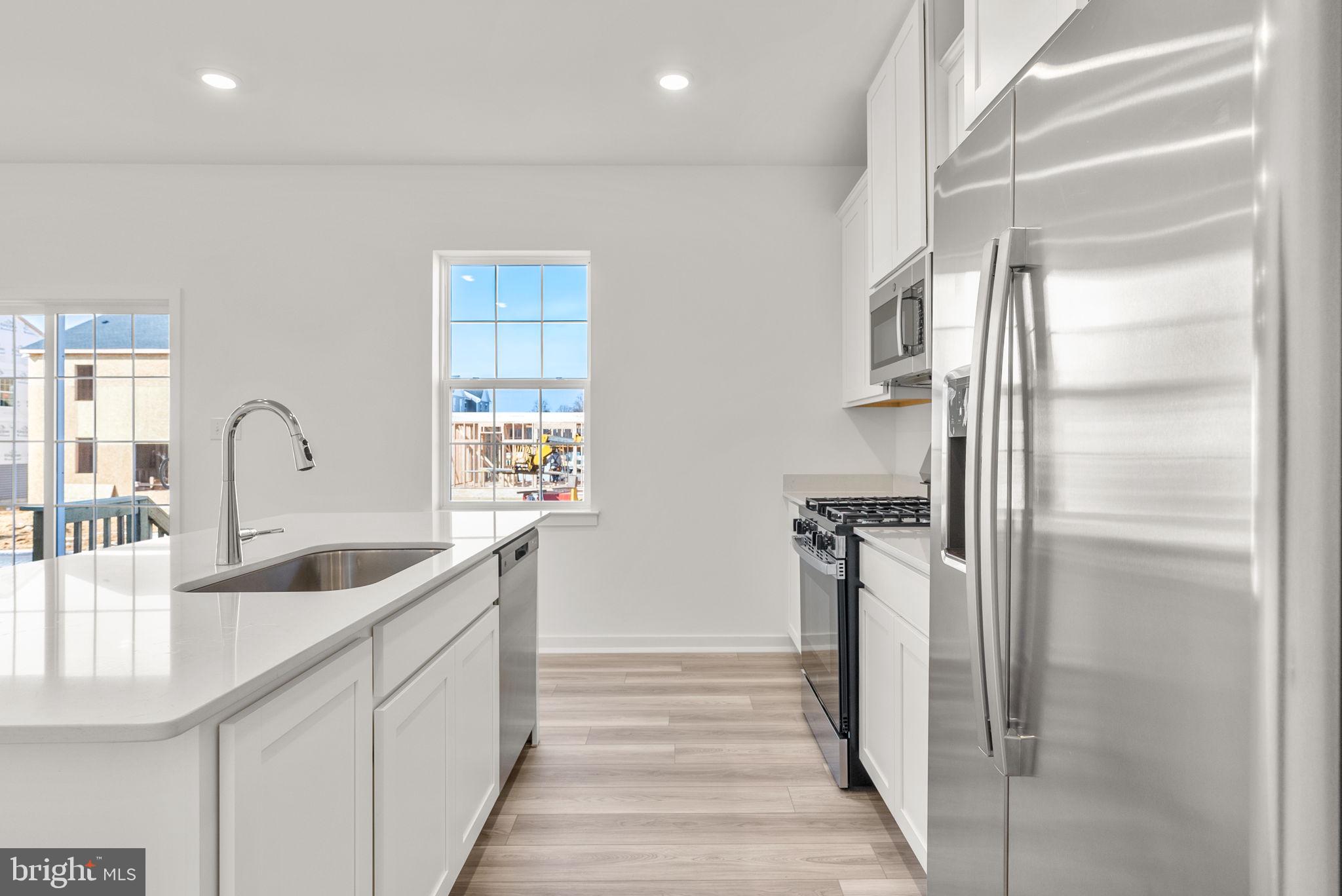 1 Inkwell Lane Sicklerville, NJ 08081 - Photo 13 of 32 a kitchen with refrigerator and sink