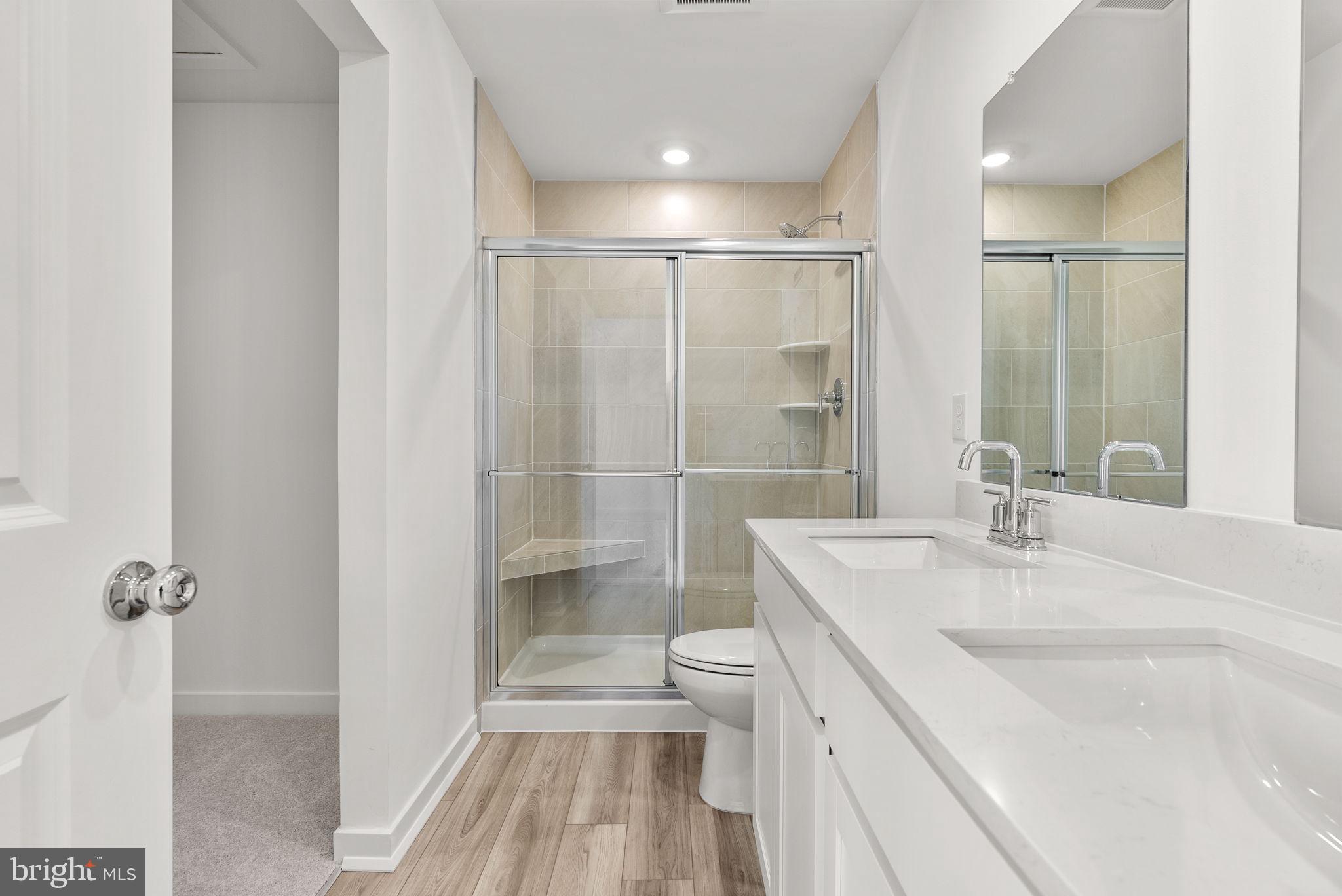 1 Inkwell Lane Sicklerville, NJ 08081 - Photo 17 of 32 a bathroom with a granite countertop sink a toilet and shower