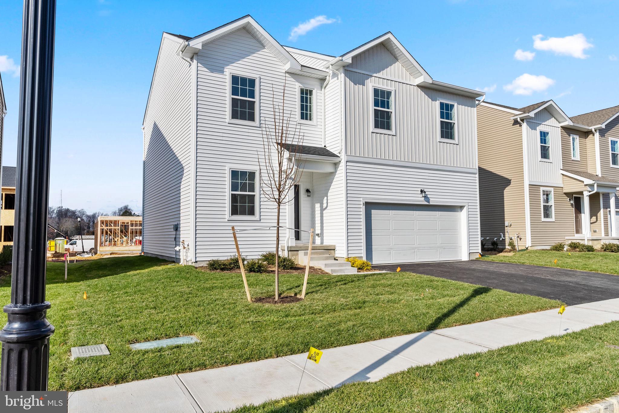 1 Inkwell Lane Sicklerville, NJ 08081 - Photo 2 of 32 a front view of a house with a yard and garage