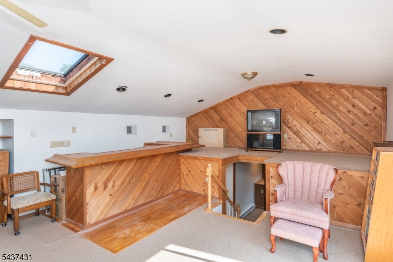 20 Wanaque Road West Milford, NJ 07421 - Photo 18 of 31 a living room with a bed and furniture