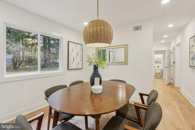 a bathroom with a sink mirror and toilet